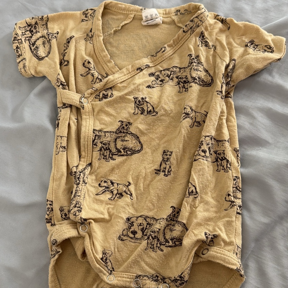 Adorable Tan wrap style onesie. Kate Quinn